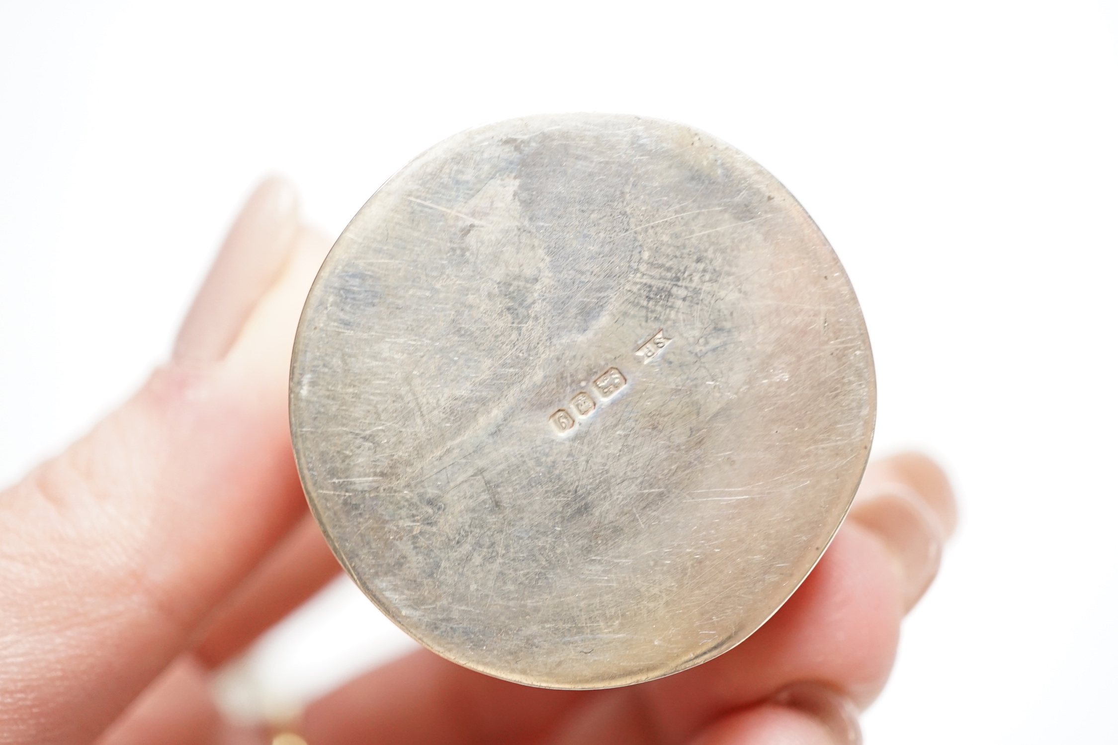 A German embossed 800 standard white metal snuff box, 87mm a silver card case, a modern silver drum shaped box(a.f.) and a silver mounted inkwell .